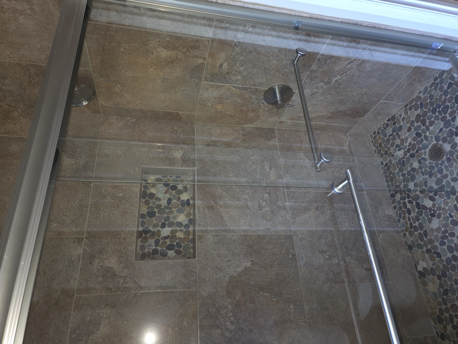 Slate shower with glass sliding doors
