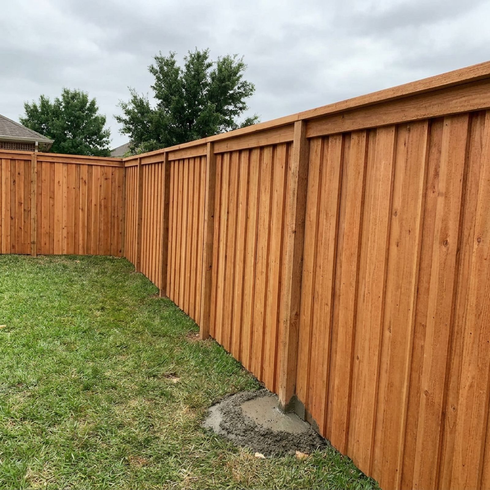 New cedar privacy fence with top cap rail